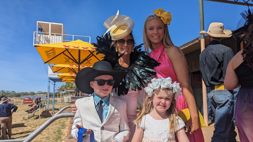 Kelli McLaughlin stands with her family at the Tennant Creek Turf Cup