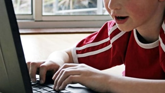 File photo: Child at a computer (www.sxc.hu: Steve Woods)