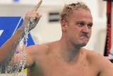 Brenton Rickard holds his finger up in celebration at the end of his lane