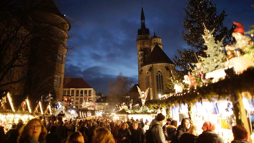 People visit the Christmas market in Stuttgart, Germany on December 19, 2012.