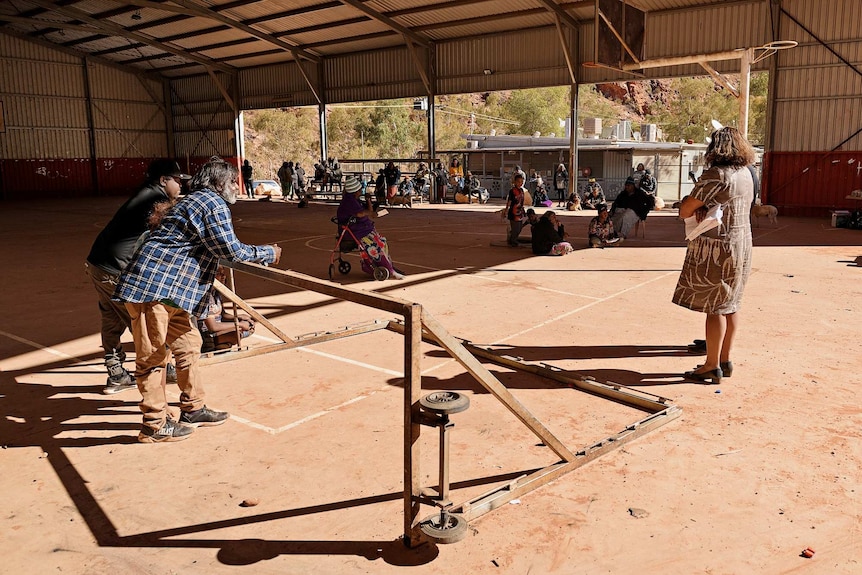 Leanne at a community meeting at the Areyonga basketball court.