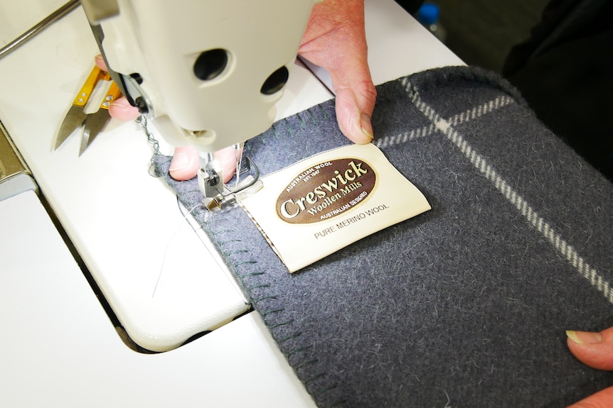 A blanket being sewed
