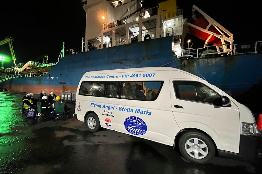 Mini bus and a coal ship.