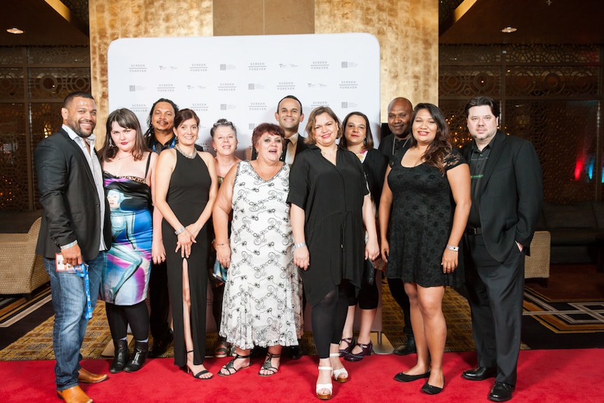 A group photo of producers and staff on the red carpet at the  Screen Producers Australia Awards.