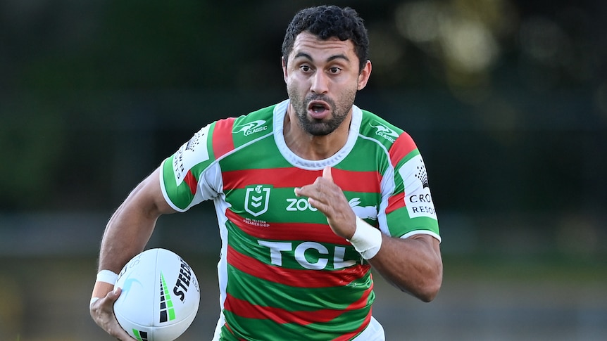 A South Sydney NRL player runs with the ball during the 2021 season.