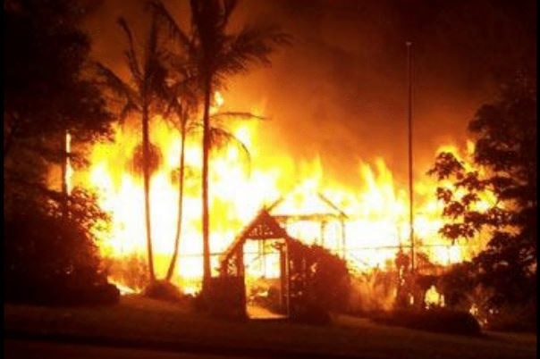 A large fire with frame of Queenslander looking home still standing at the front.