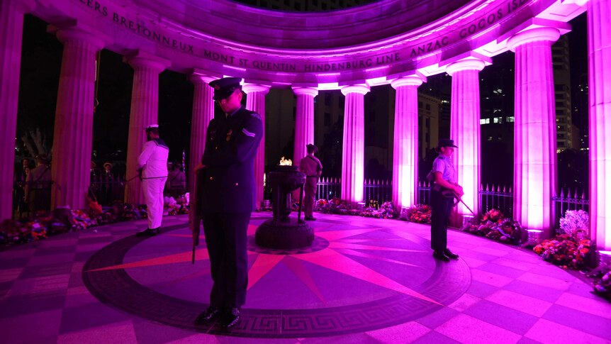 Defence Force personnel stand guard at the Eternal Flame during an ANZAC Day Dawn Service in Brisbane, Saturday, April 25, 2015.