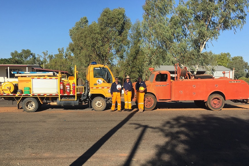 Thargomindah fire crew and the old and new trucks