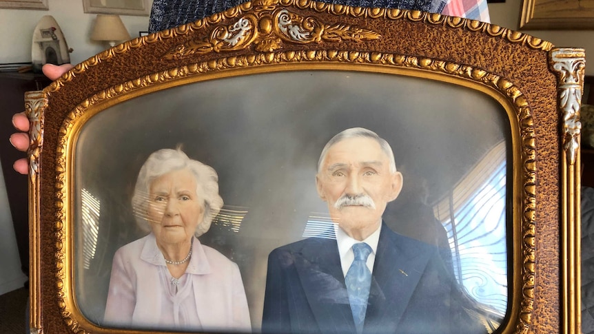 The old gold gilt framed portrait of Tom and Amelia Jones.