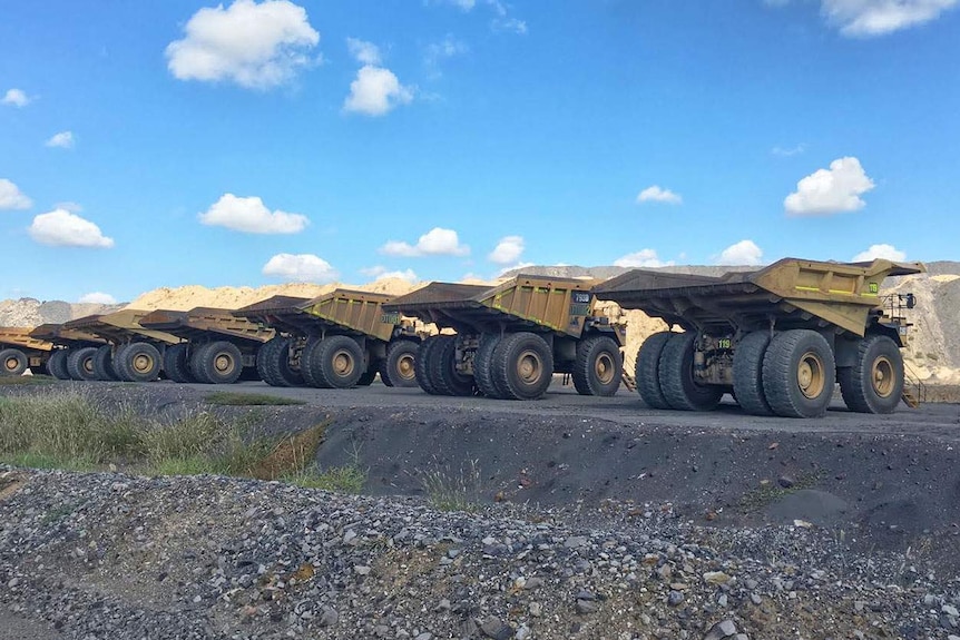 Mining trucks at a coal operation in central Queensland.