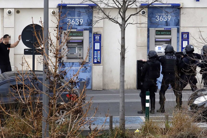 A man who had taken two hostages in a post office surrenders to French police