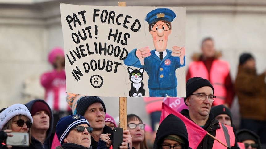 A group of workers dressed in pink high vis