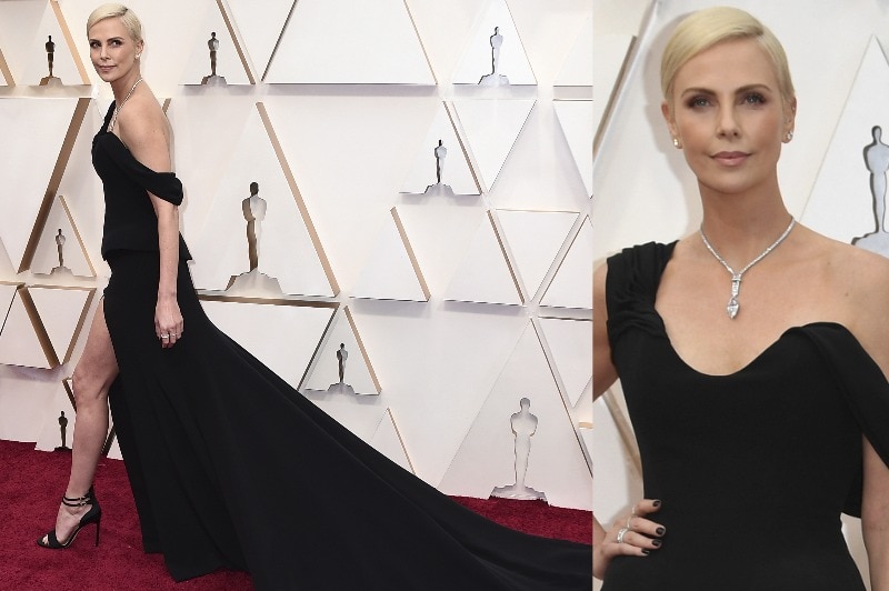 Charlize Theron  in a black dress on the red carpet.