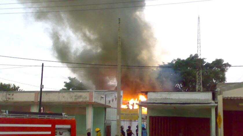 Violence: A building burns in Dili