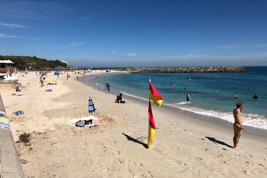 Several dozen people scattered across the normally popular Cottesloe Beach.