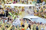 Philippines pilgrims brave rain to see Pope