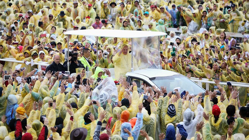 Philippines pilgrims brave rain to see Pope