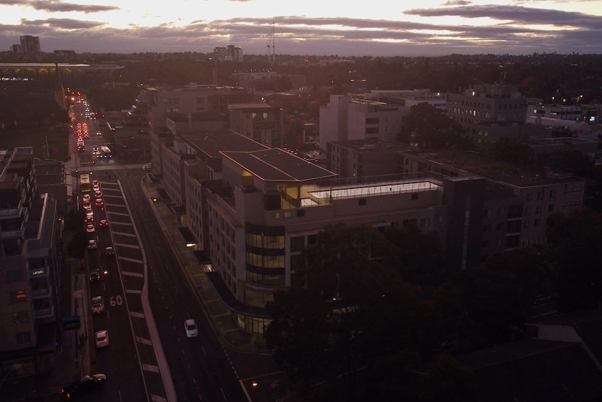 A drone image of Parramatta at sunset, focused on one apartment block.