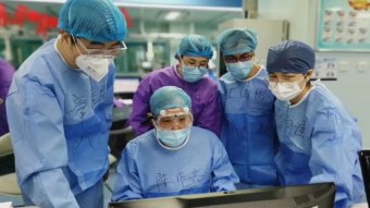 Medical workers in Wuhan have written their names on their scrubs.