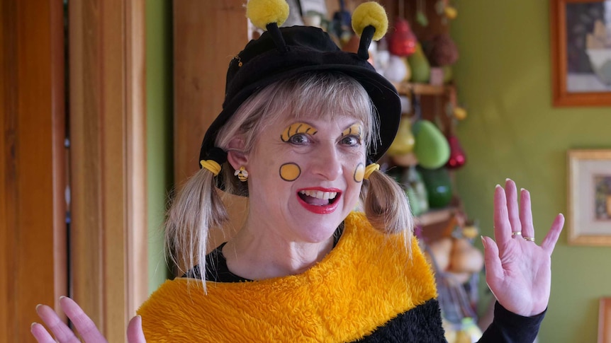 A woman dresses as a bee