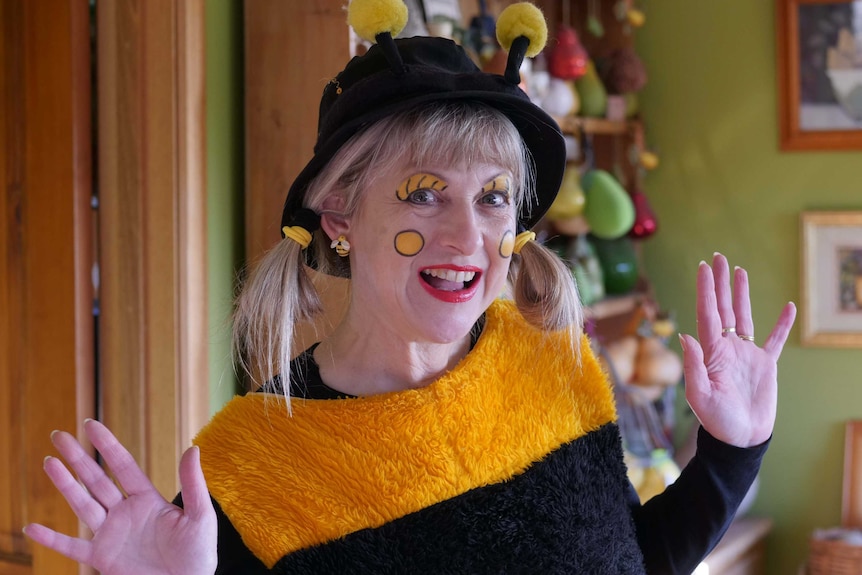 A woman dresses as a bee