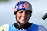 An Australian canoe slalom athlete smiles after her run during an event at the 2023 world titles.
