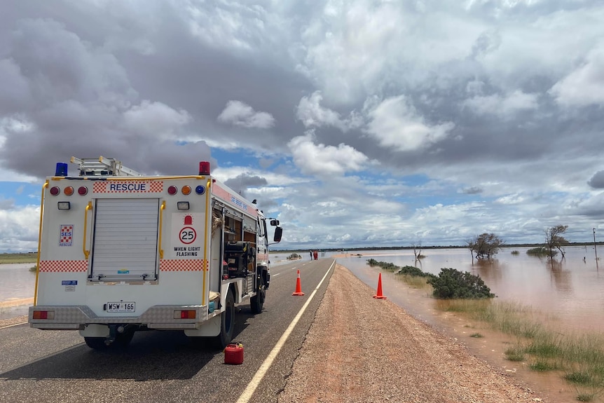 A fire engine on an outback road.