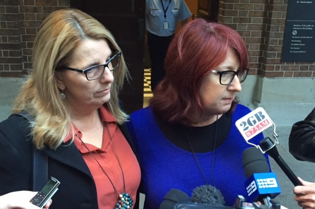 Alison McKenzie (left) and his sister Fran Pearce solemnly speak to the media outside court.