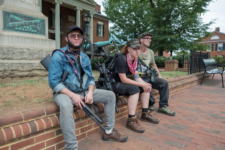 Members of Redneck Revolt sit in Charlottesville.