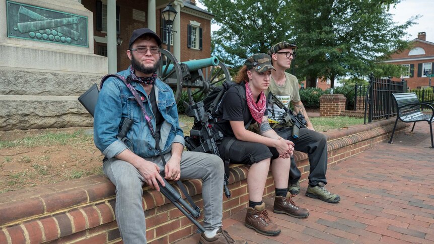 Members of Redneck Revolt sit in Charlottesville.