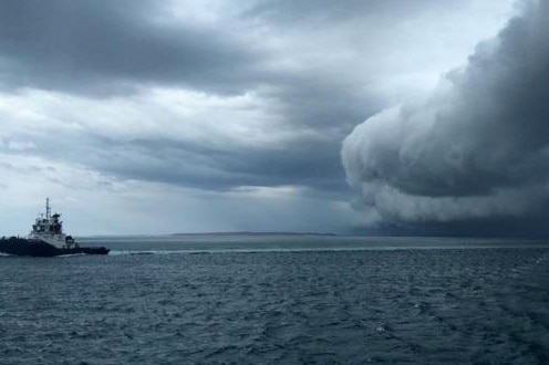 Tub boat against back drop of Cyclone Stan off the Pilbara coast near Port Hedland 30 January 2005