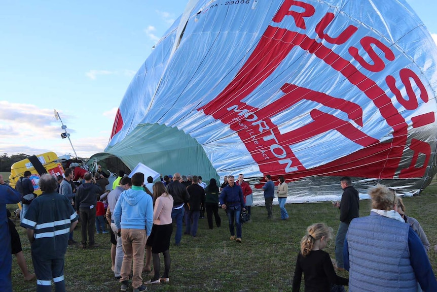 People gathered around Fedor Konyukhov's balloon after it landed.
