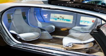 A futuristic looking interior of a driverless car