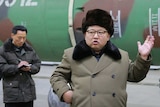 North Korean leader Kim Jong-un talking to nuclear scientists.