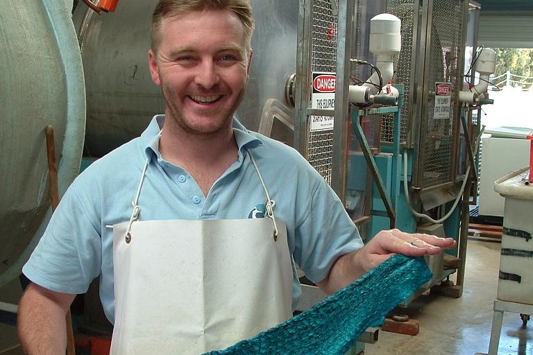 David MacDermott holding fish leather