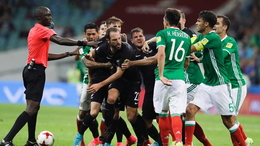 New Zealand and Mexico players fight in Confederations Cup match