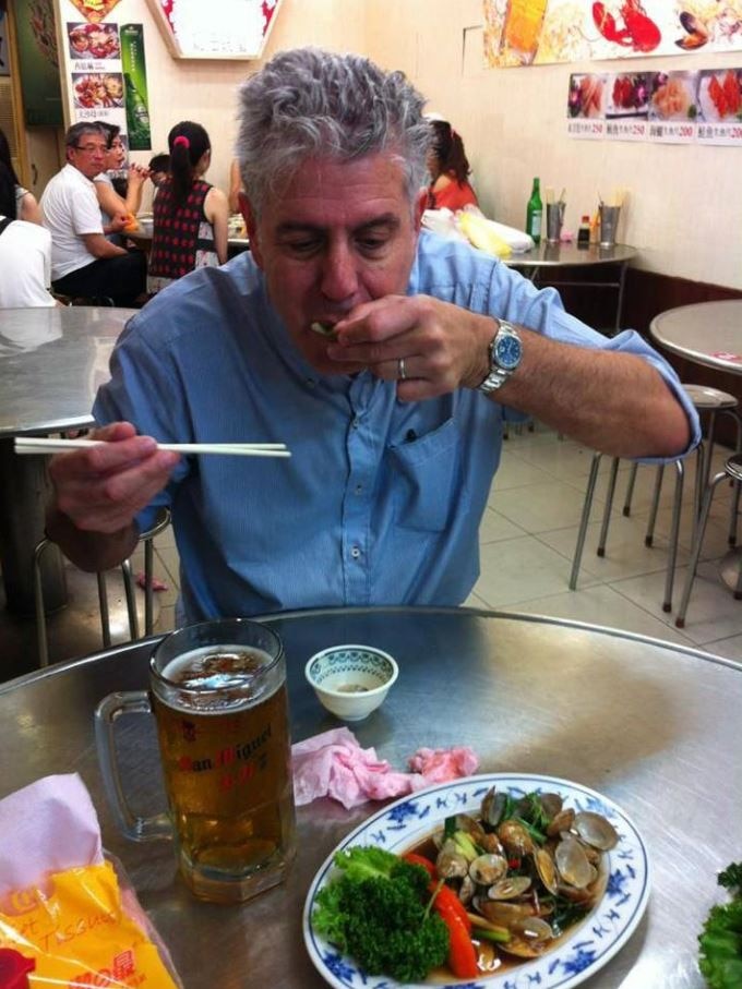 Anthony Bourdain eating.