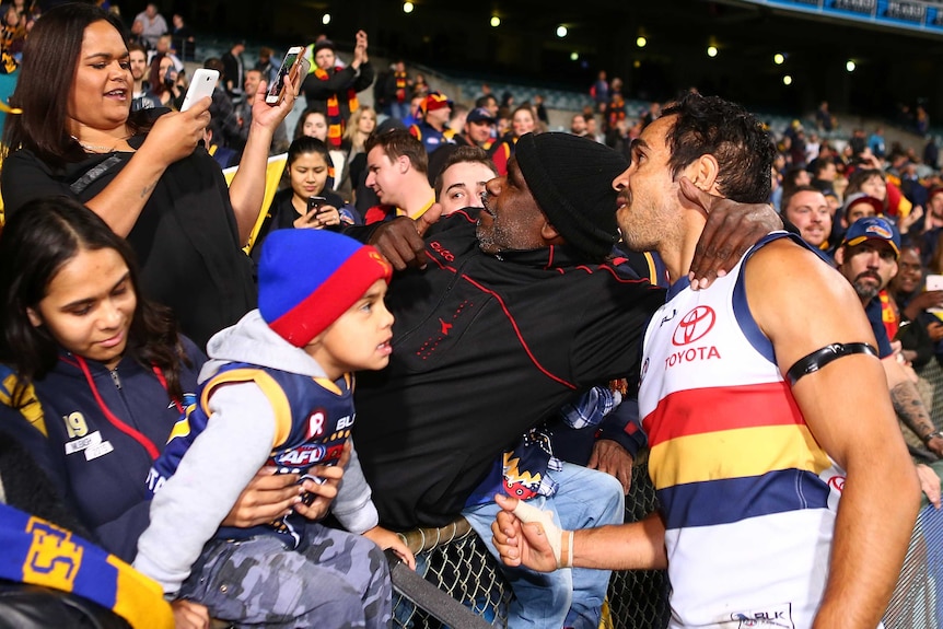 Eddie Betts celebrates with fans after Adelaide's win over West Coast