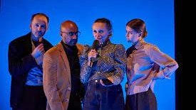 Four actors on stage in 'Die Redaktion'
