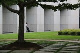 A worker enjoys the surroundings of the Senate courtyard.