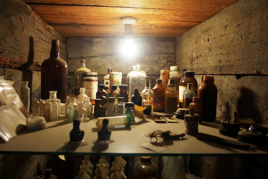 A collection of instruments and bottles found during the excavation of the hospital