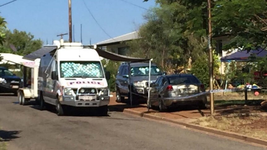 Police vehicles outside a house in Mount Isa in north-west Queensland.