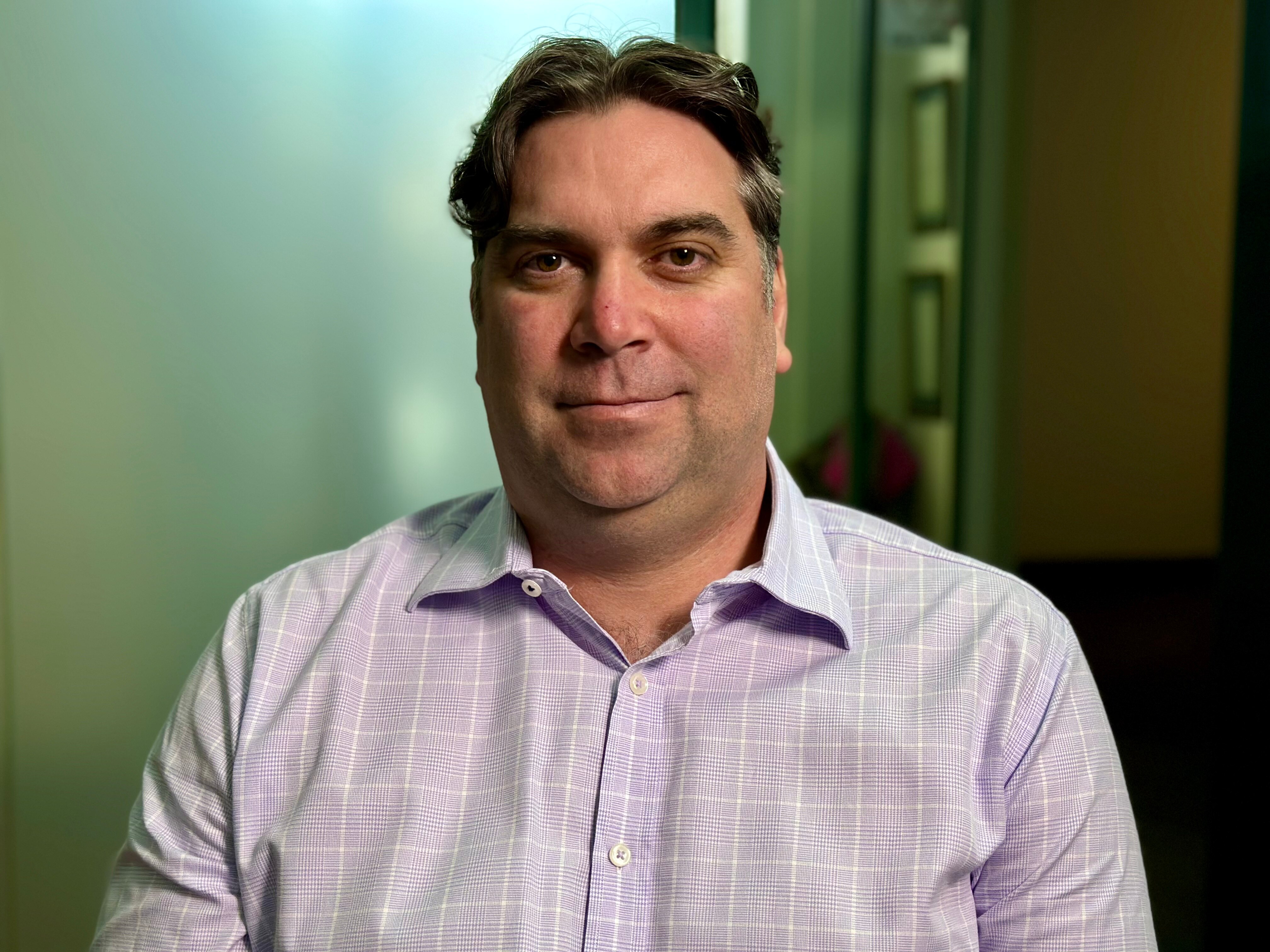Man wearing a light purple business shirt.