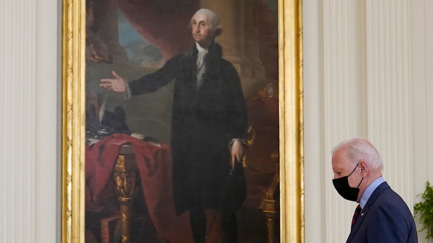 Joe Biden walks to a podium