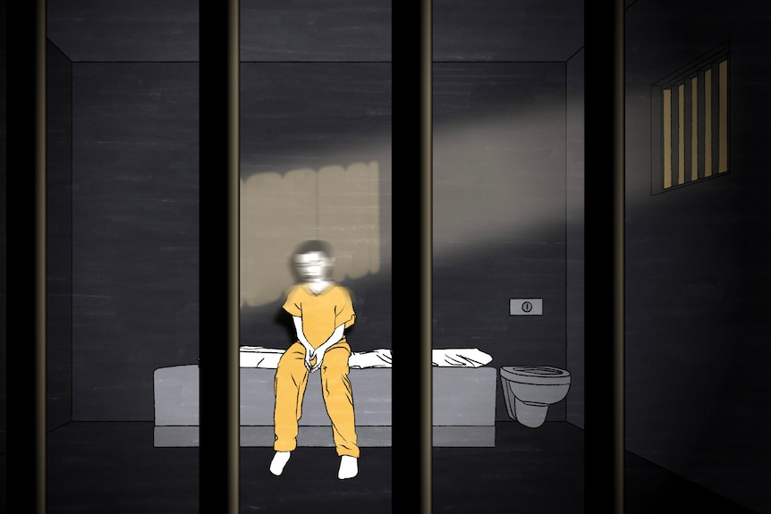 Illustration of boy wearing yellow jumpsuit sitting on bed in solitary confinement, light spilling through window.