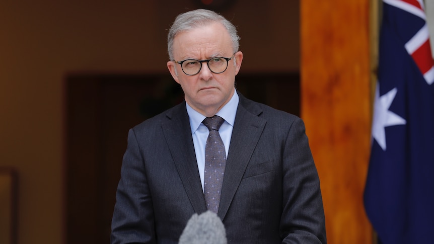Anthony Albanese looks annoyed as he addresses the media