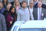 Prince Harry and Meghan at an airport