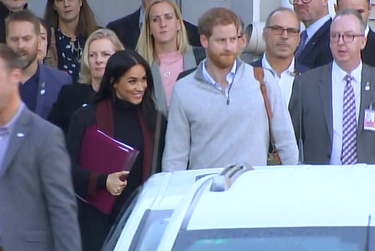 Prince Harry and Meghan at an airport