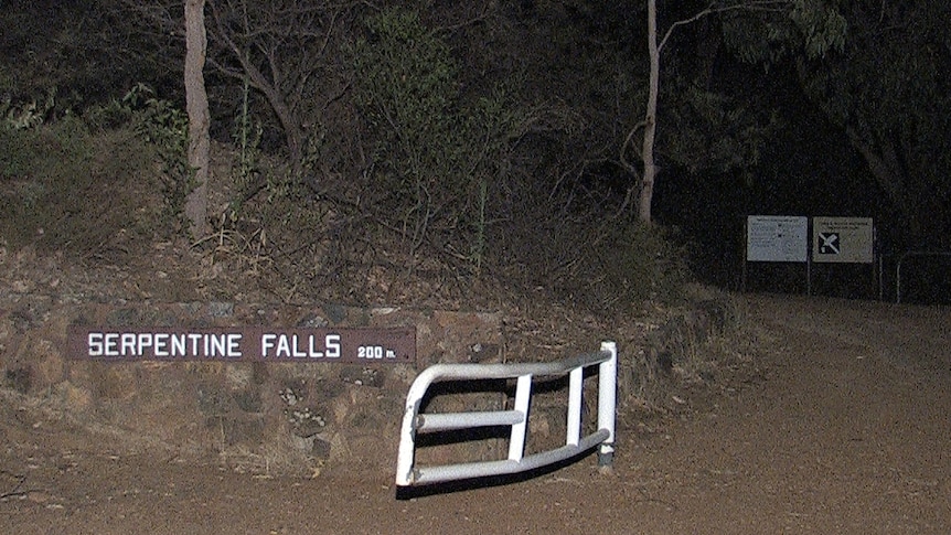 Serpentine Falls sign at night