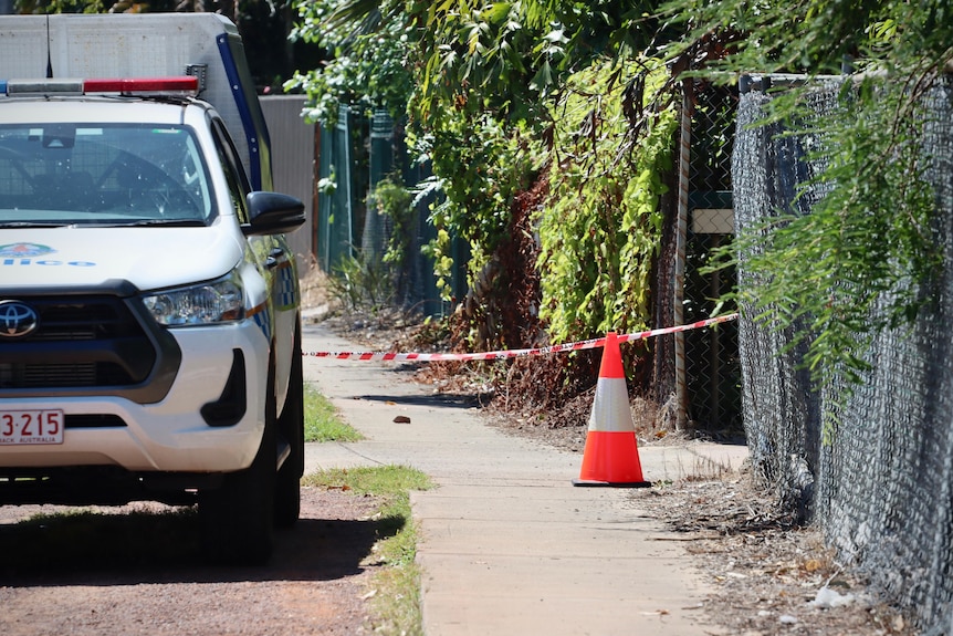 A police cordon and police car out the front of a suburban Darwin home